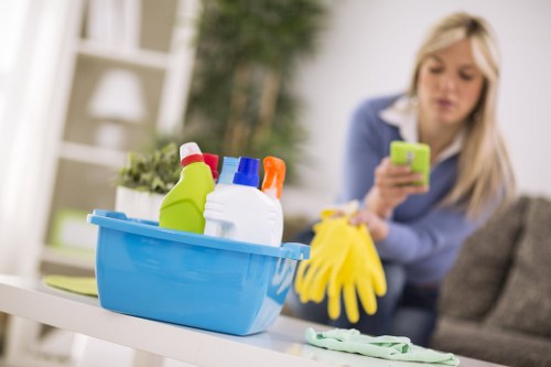 Kitchen deep cleaning with appliances, counters, and cabinets being sanitized